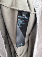 Gray hoodie inside neck showing black brand care label tag