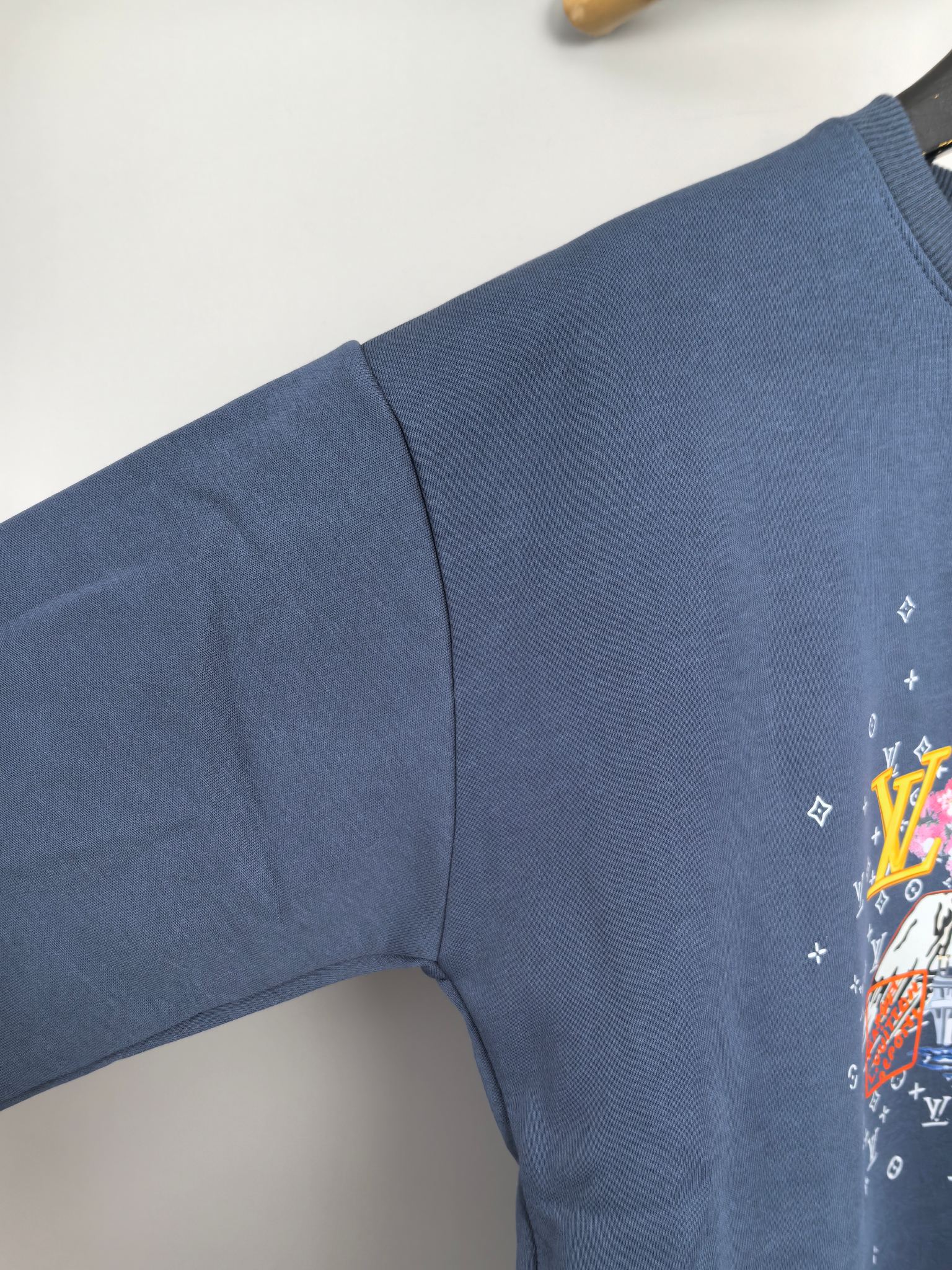 Louis Vuitton dark blue sweatshirt sleeve with small monogram-style motifs