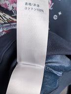 Louis Vuitton clothing label reading 100% cotton