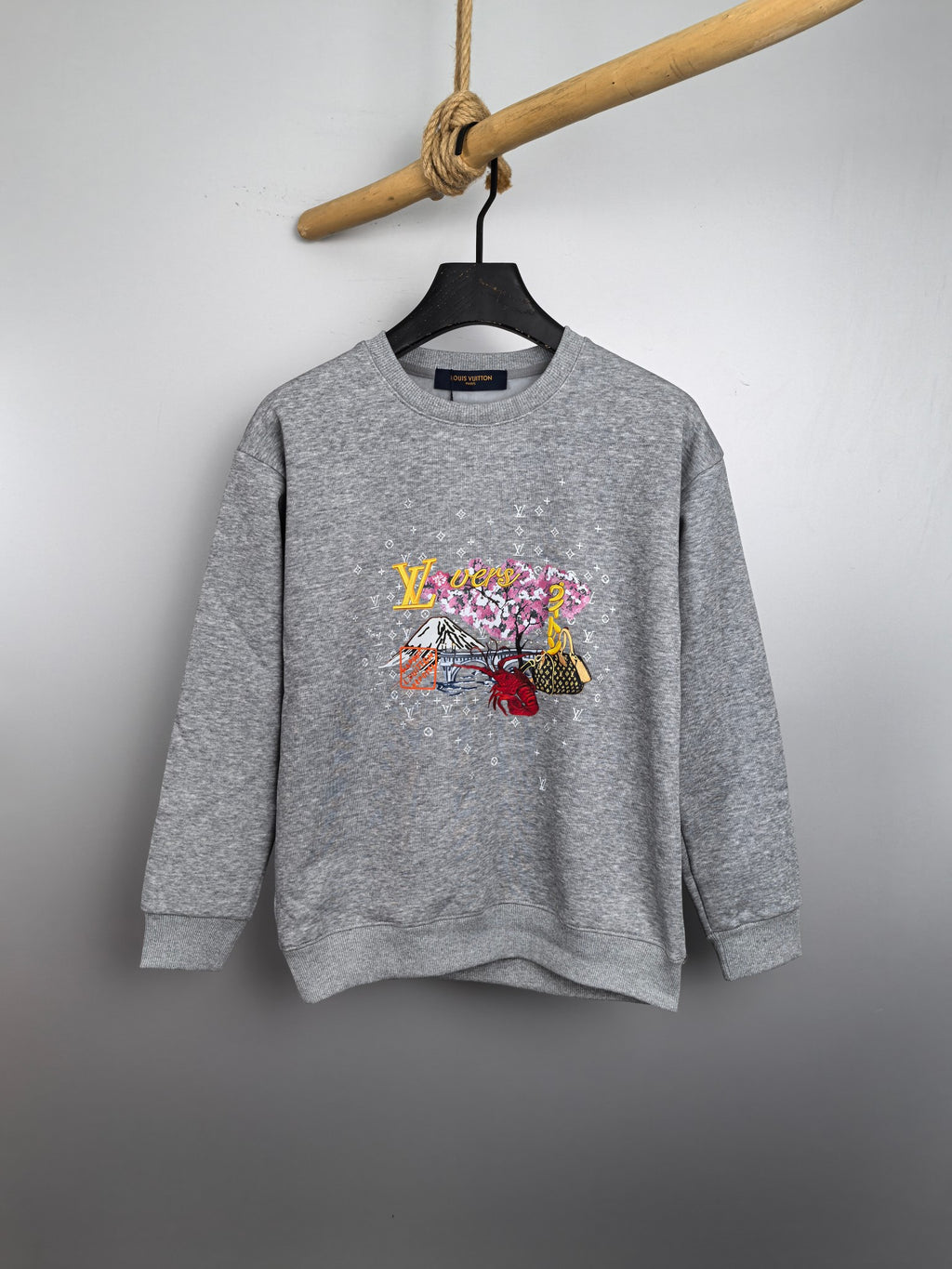 Gray long-sleeve sweatshirt with colorful front graphic print and crew neckline