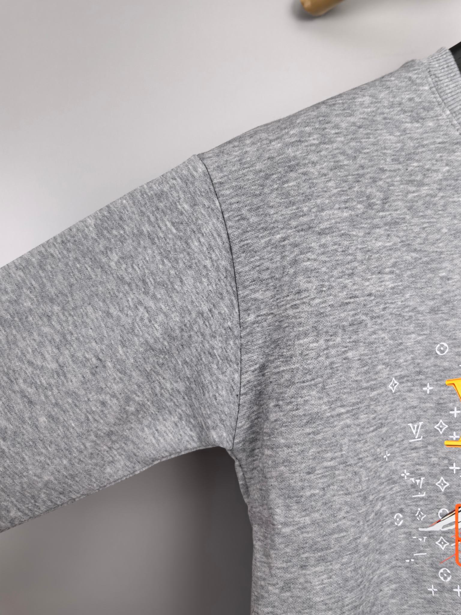 Gray long-sleeve sweatshirt sleeve with side seam and partial graphic print