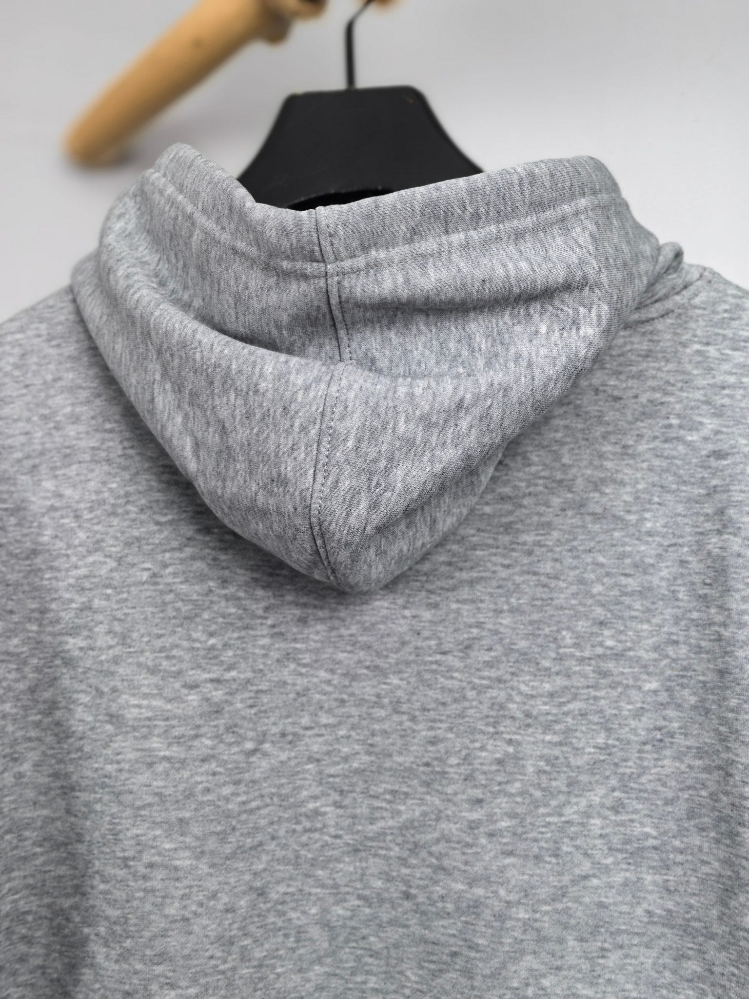 Gray kids hoodie back view with thick hood and stitched seams