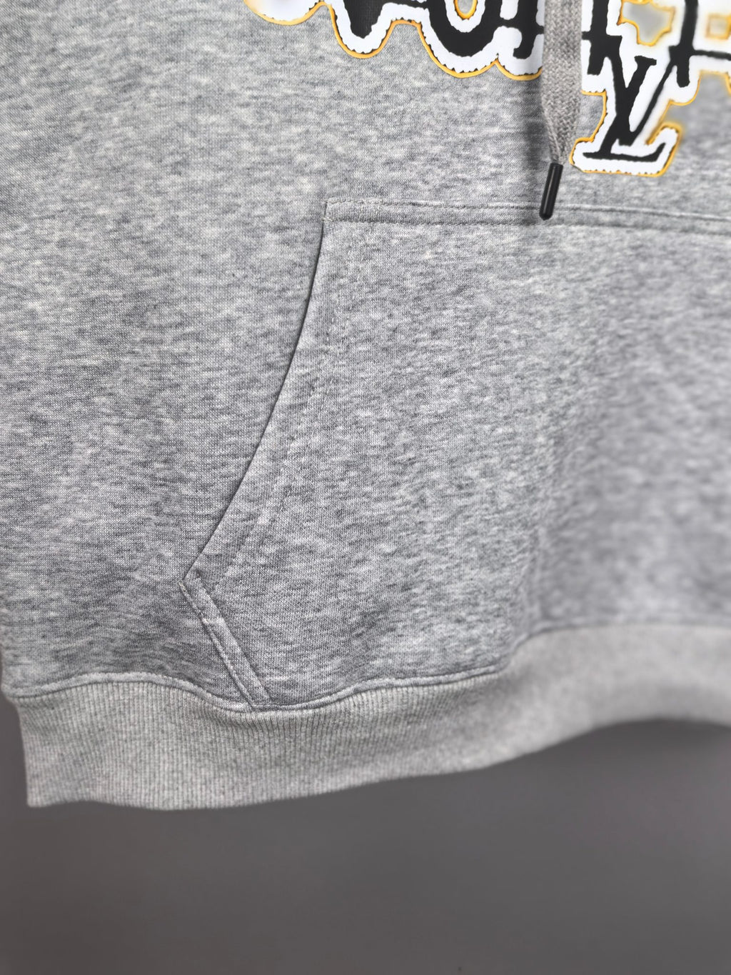 Gray kids hoodie front with kangaroo pocket and drawstring hood detail