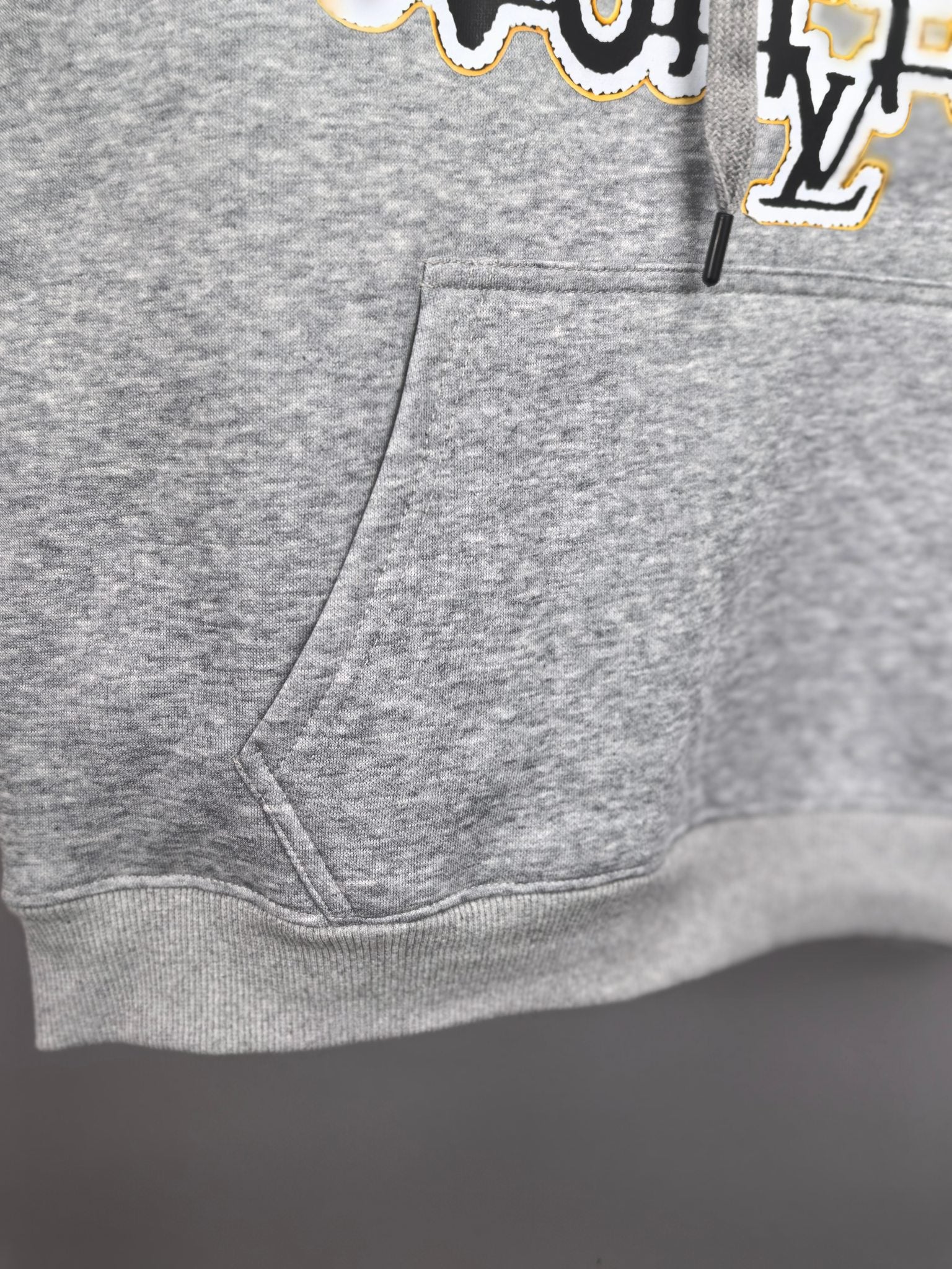Gray kids hoodie front with kangaroo pocket and drawstring hood detail