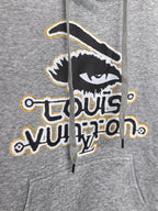 Gray kids hoodie close-up of front graphic print with bold Louis Vuitton emblem