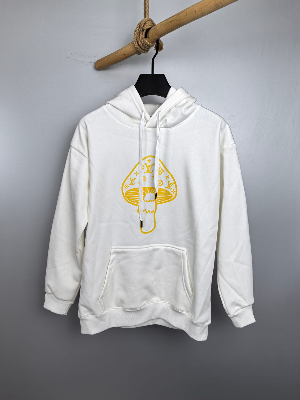 White long-sleeve hoodie with gold logo teddy graphic and front pouch pocket