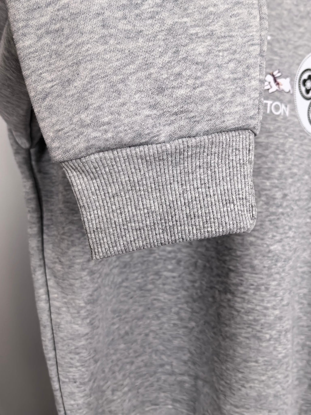 Heather gray sweatshirt sleeve cuff with ribbed knit hem