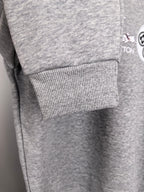 Heather gray sweatshirt sleeve cuff with ribbed knit hem