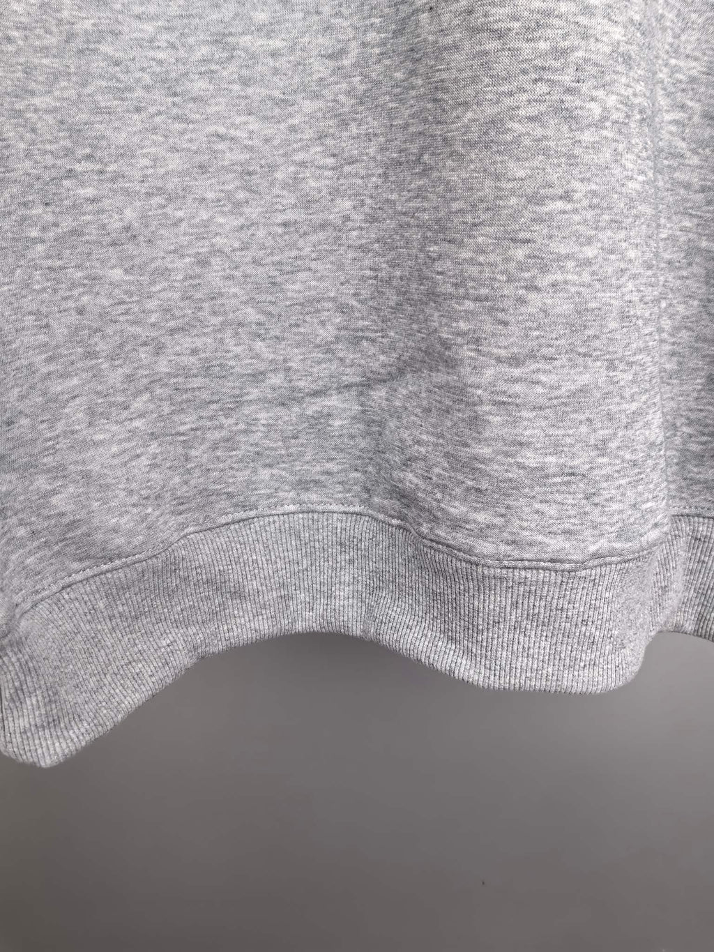 Heather gray sweatshirt hem with ribbed knit finish