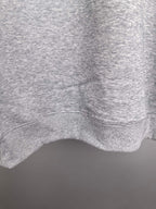 Heather gray sweatshirt hem with ribbed knit finish