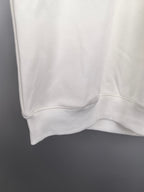 White sweatshirt lower hem with ribbed cuff detail