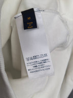 White sweatshirt care label and size tag, made in Italy