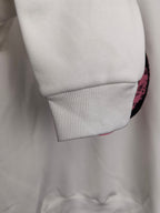White long-sleeve sweatshirt cuff with ribbed sleeve hem