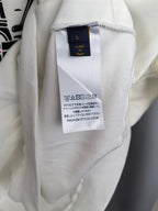 White sweatshirt interior neck label marked "Made in Italy"