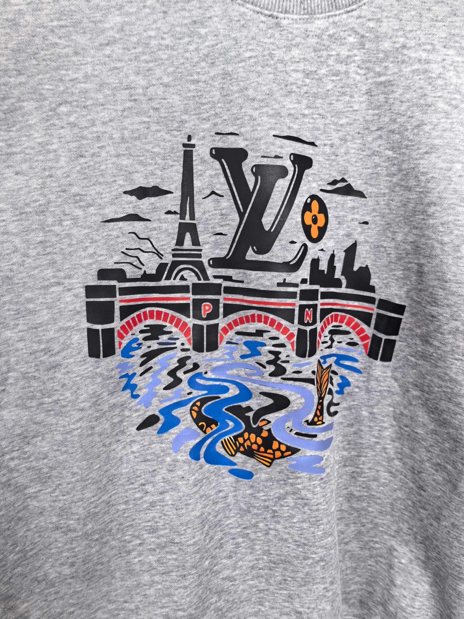 Grey crewneck sweatshirt front with large multicolor city and water graphic
