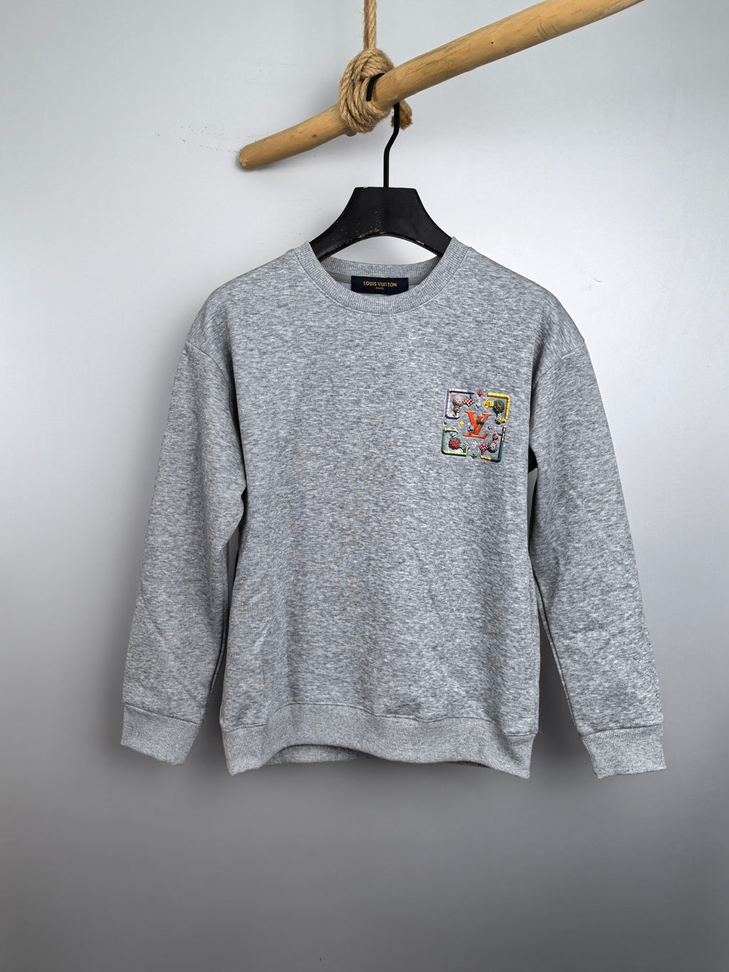 Light gray long-sleeve crewneck sweatshirt with colorful front graphic