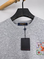 Gray crewneck sweatshirt neckline with inner brand label and hanging tags