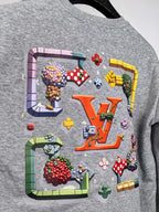 Gray crewneck sweatshirt with multicolor graphic across chest