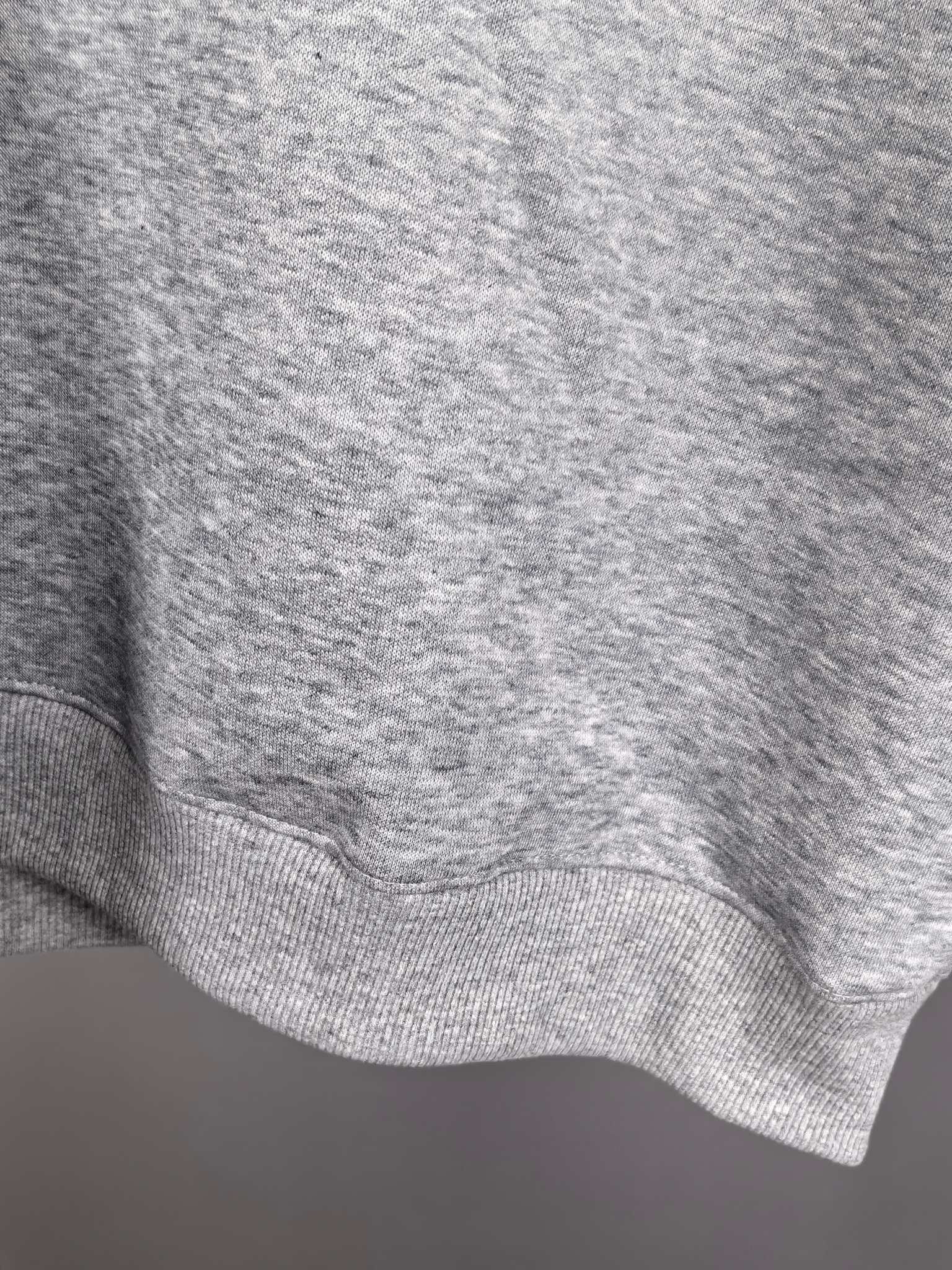 Gray ribbed sweatshirt hem with knit texture