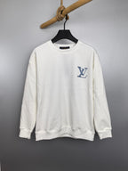 White Louis Vuitton sweatshirt with blue logo graphic at chest