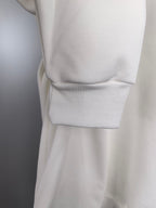 White sweatshirt with ribbed cuff and gathered waist hem