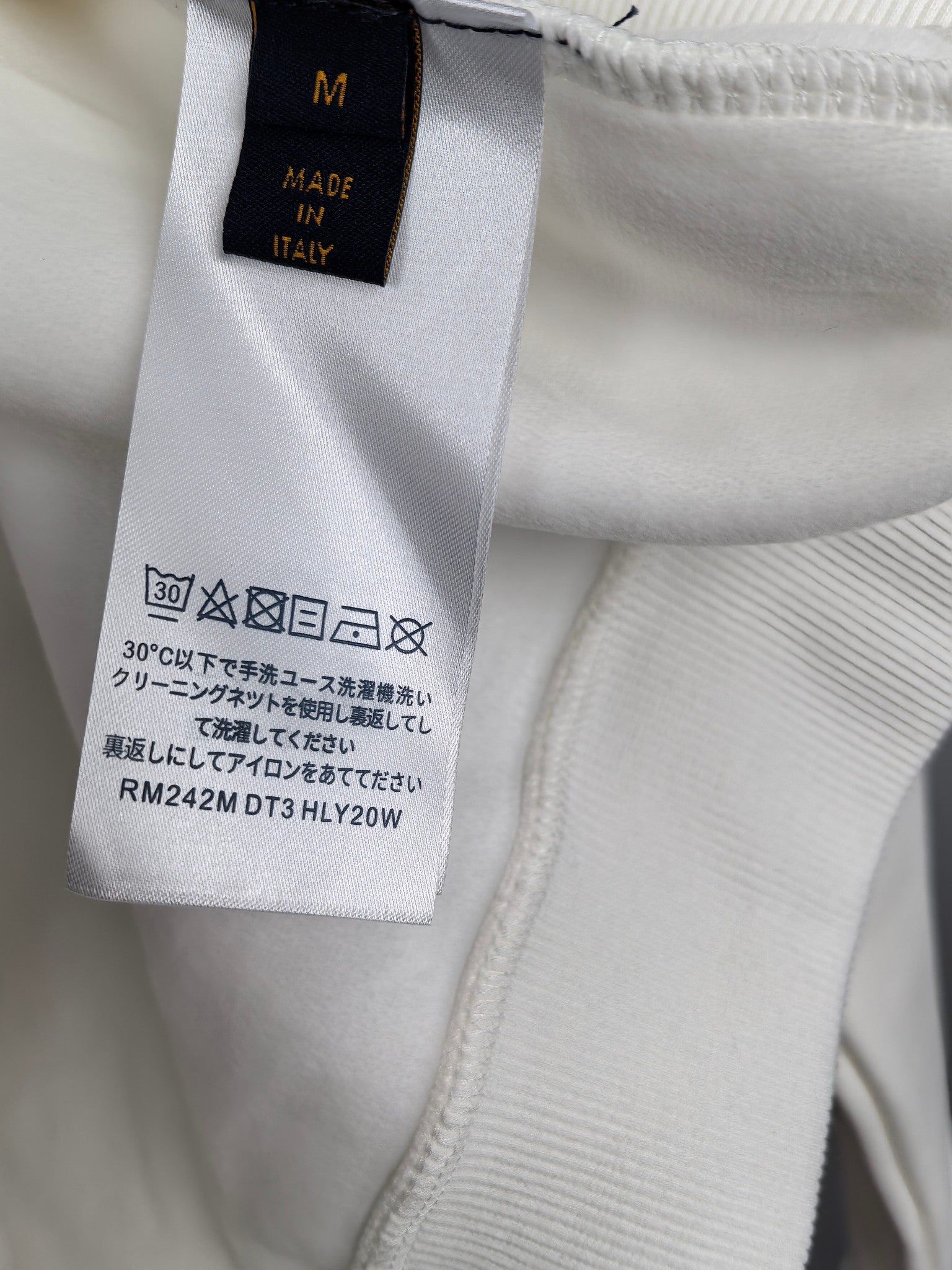 Louis Vuitton sweatshirt inside neck label with “Made in Italy” and care text