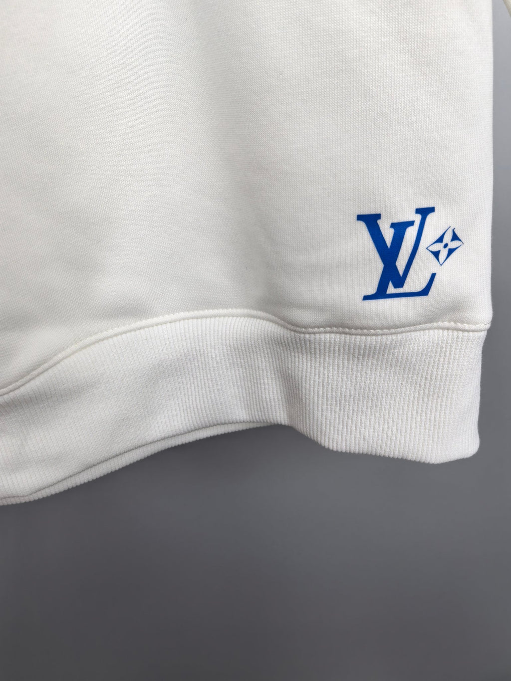 Louis Vuitton white sweatshirt lower sleeve area with small blue “LV” logo