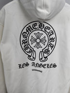 White hoodie front with large circular logo and “Los Angeles” lettering