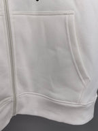 White zip-up hoodie front pocket and zipper tape detail