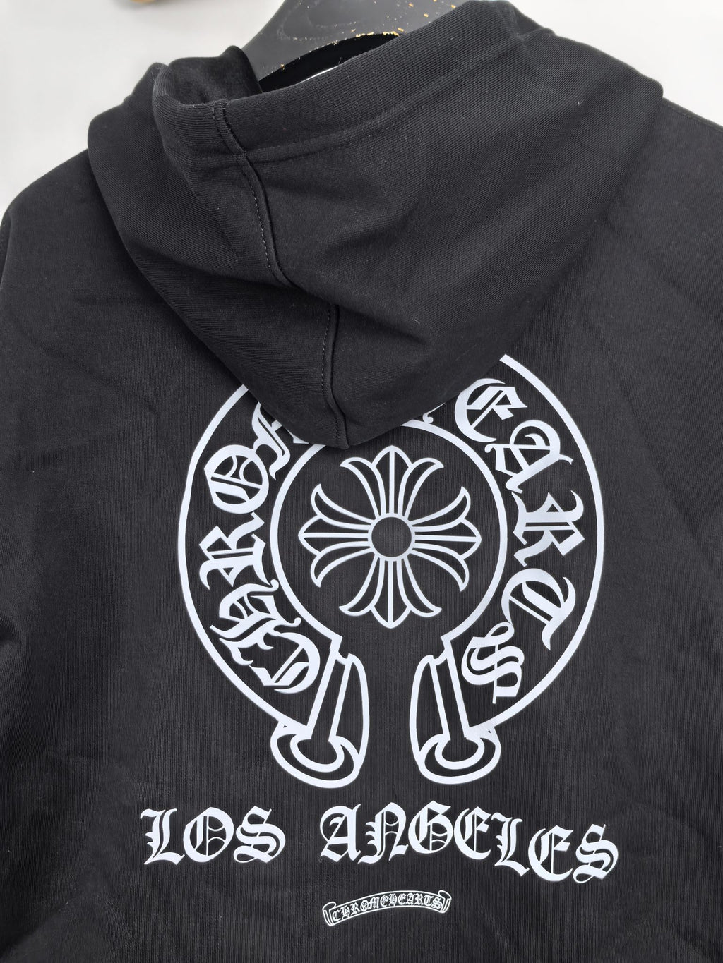 Black zip-up hoodie with back hood and large Los Angeles graphic