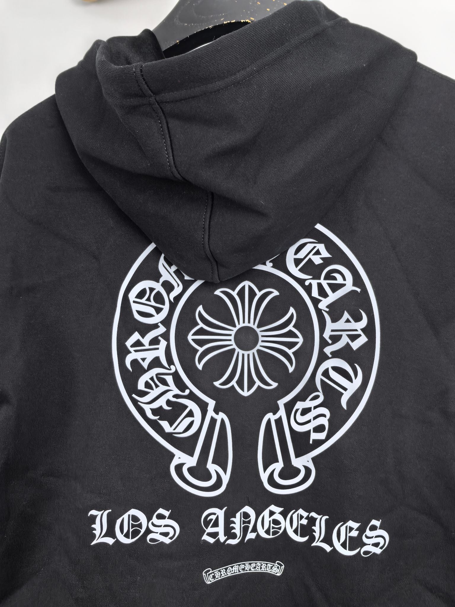 Black zip-up hoodie with back hood and large Los Angeles graphic