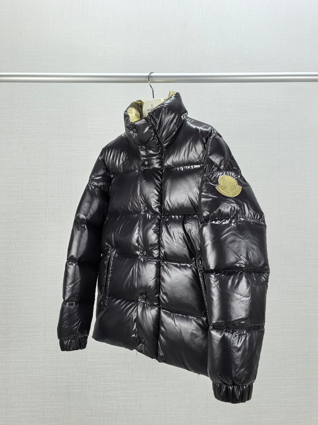 Moncler black quilted puffer jacket with stand collar and chest badge detail