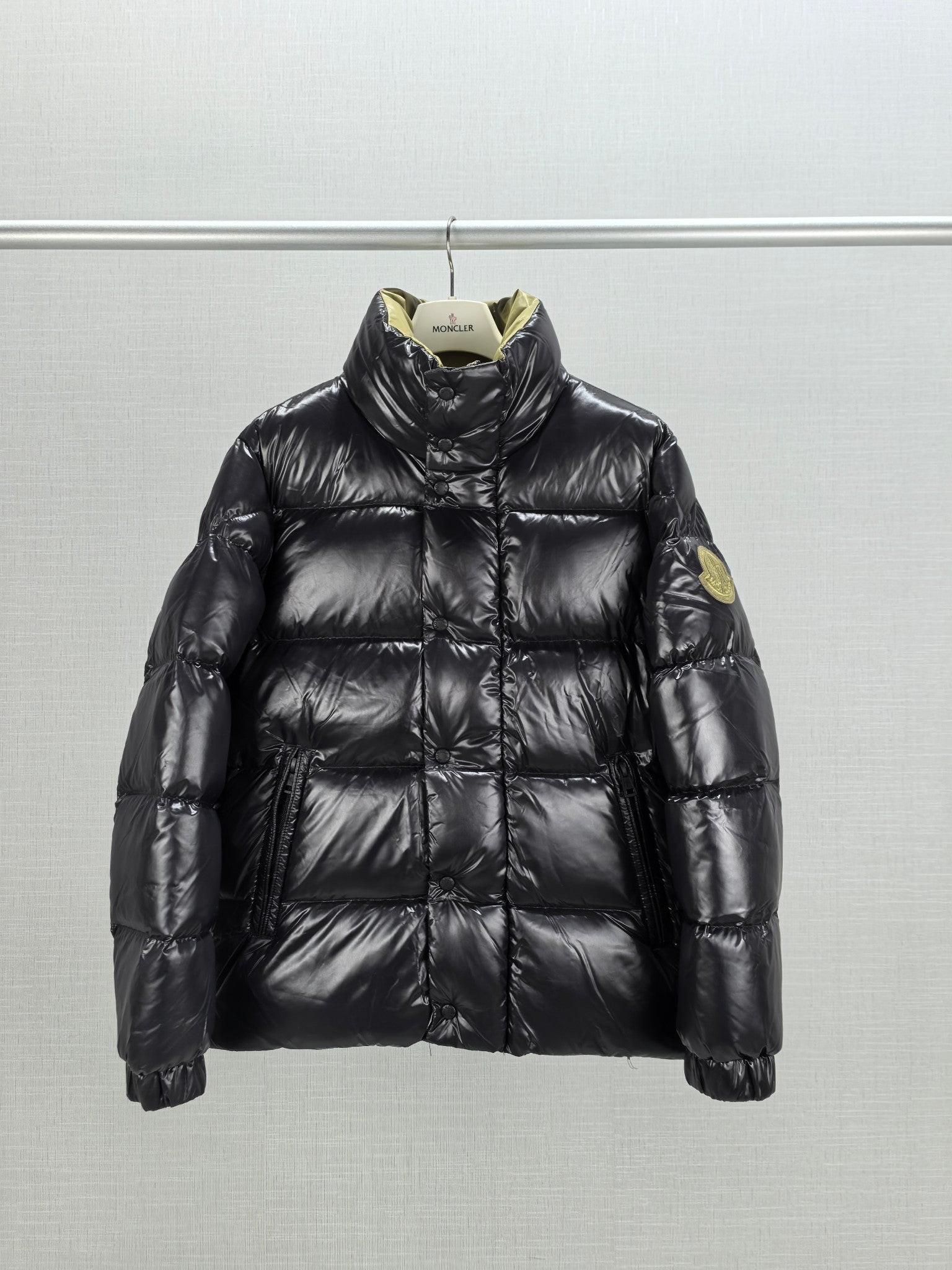 Moncler black quilted puffer jacket with stand collar and buttoned front