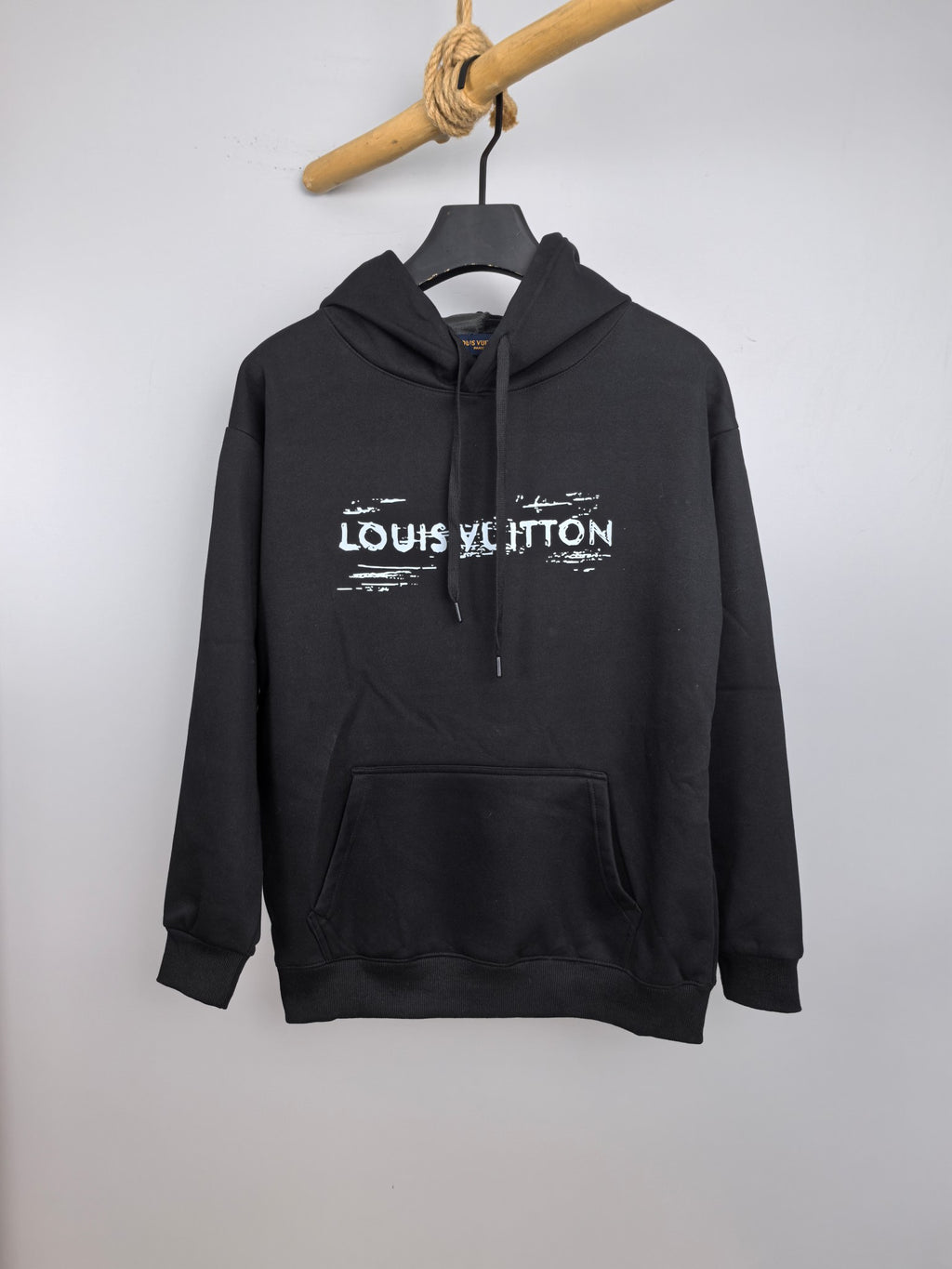 Black Louis Vuitton logo hoodie with hood, front pouch pocket, drawstring ties.