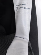Black hoodie label reading '100% COTTON' and 'PRINCIPAL - MAIN'.