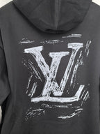 Black hoodie hood with large Louis Vuitton LV graphic print on the back.