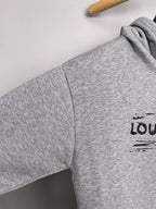 Heather gray hoodie side panel with small Louis Vuitton logo on the sleeve