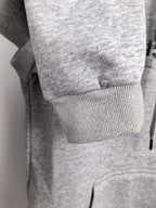 Heather gray hoodie with ribbed cuffs and ribbed hem detail