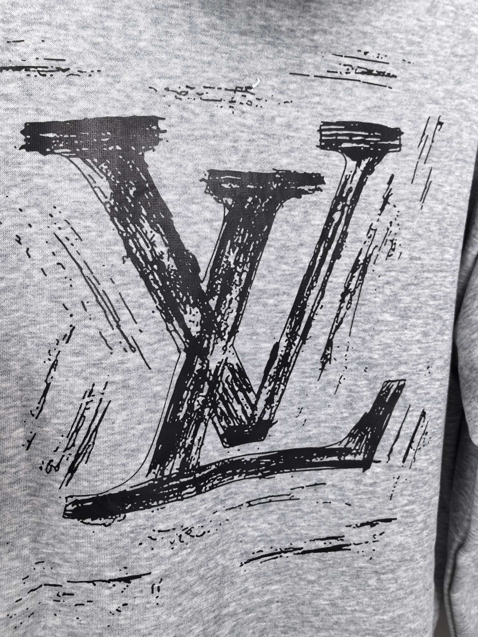 Heather gray hoodie close-up of bold black LV logo print