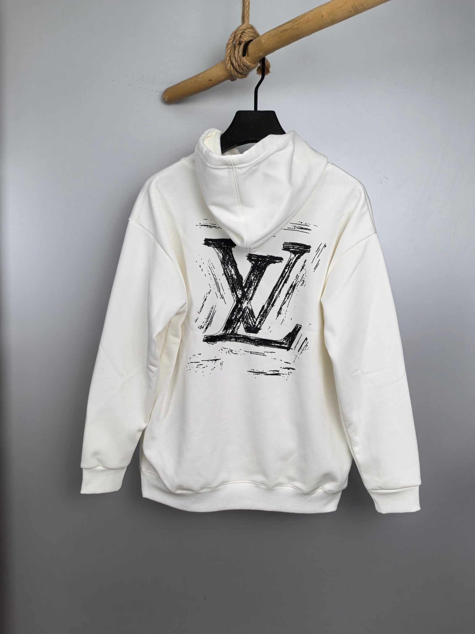 Louis Vuitton long-sleeve hoodie, white, large LV print on chest.
