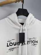 Louis Vuitton hoodie neckline close-up, white with drawstring and LV logo print.