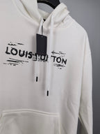 Louis Vuitton long-sleeve hoodie, white, centered LV logo and black drawstrings.