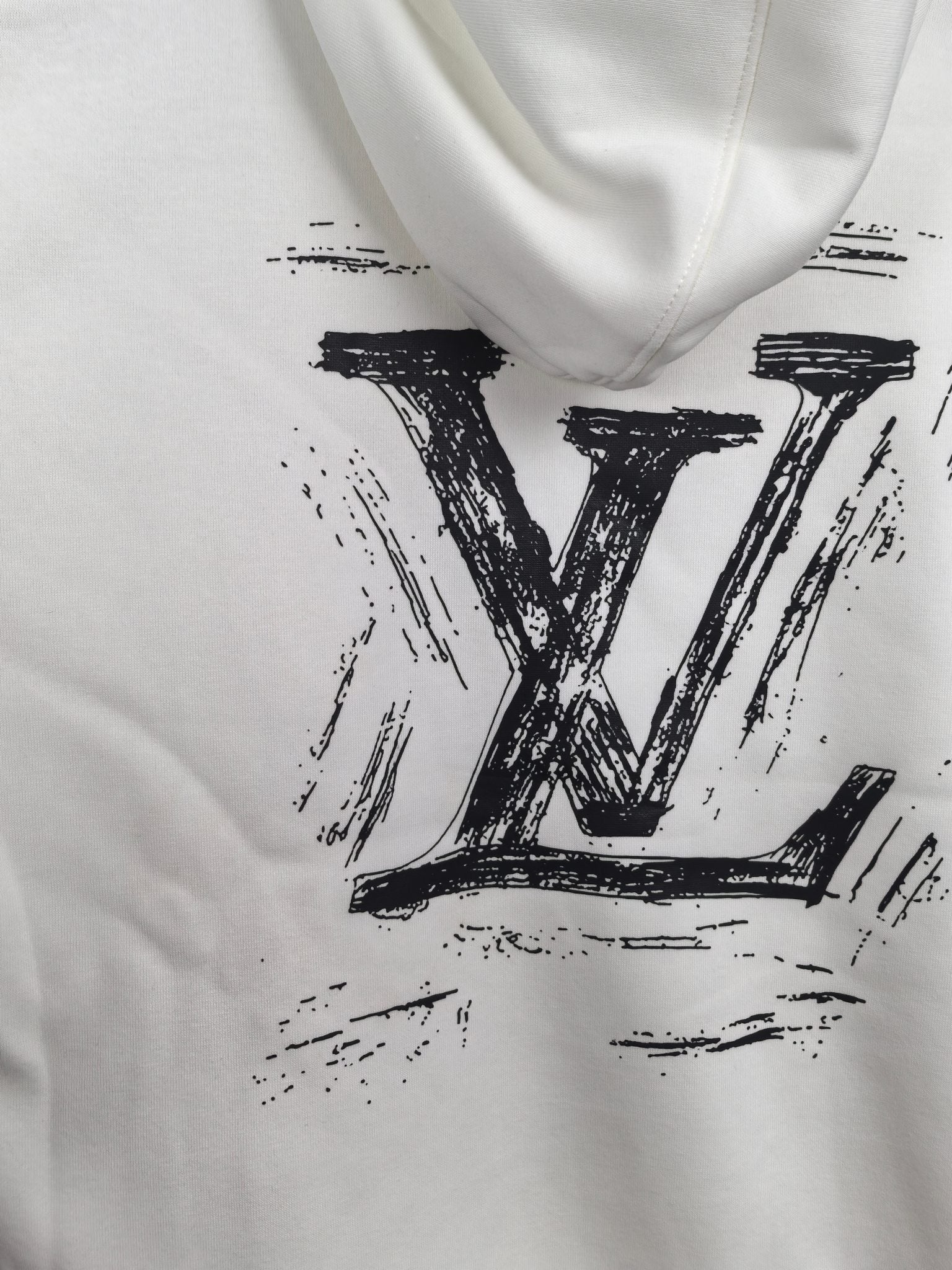 White hoodie with large black LV logo print at center.