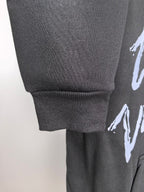 Dark gray hoodie cuff and hem with ribbed knit and side graphic print