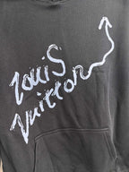 Dark gray hoodie chest graphic logo in white paint-style lettering
