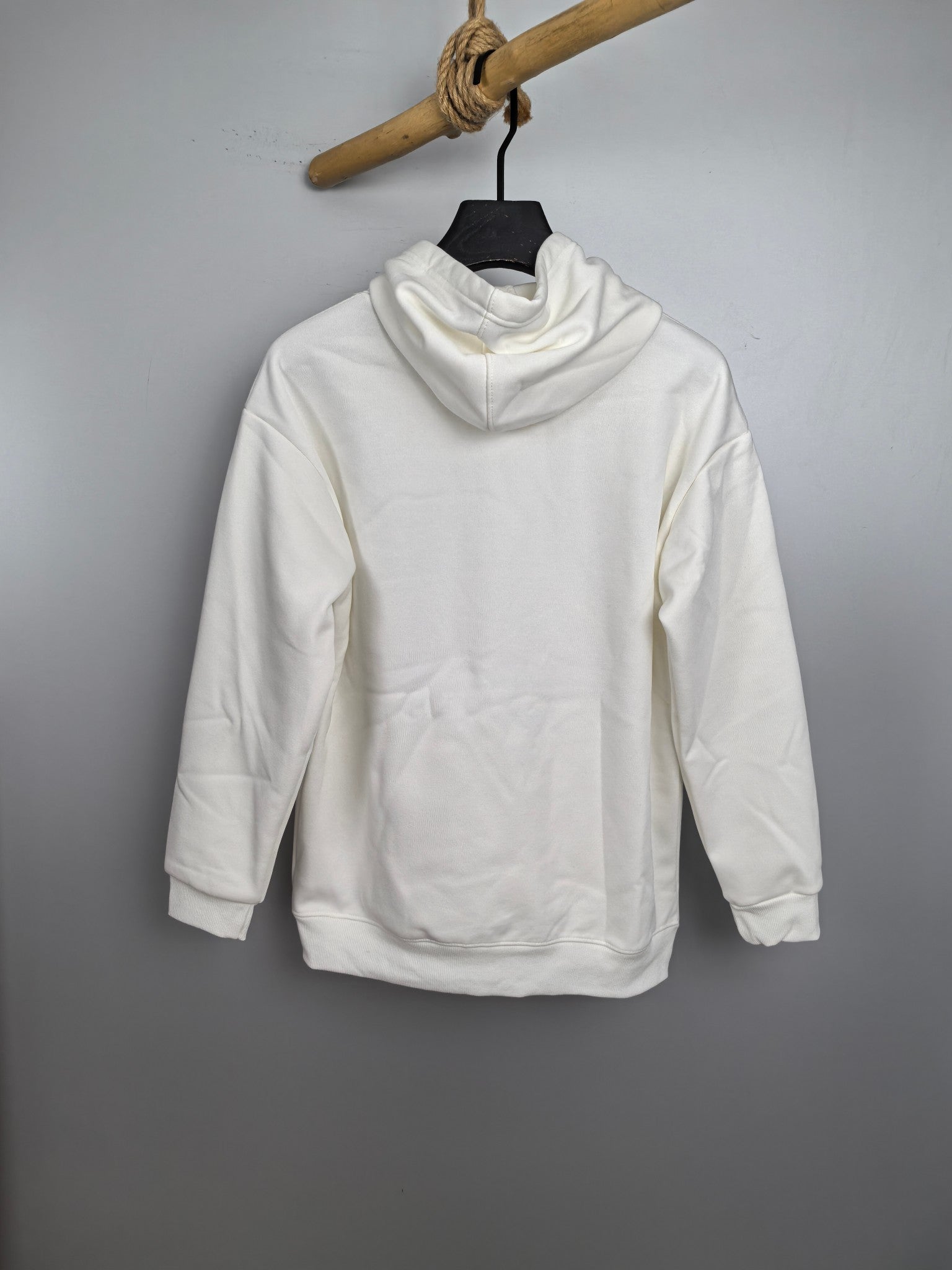 White hoodie with pullover hood and front kangaroo pocket, long sleeves