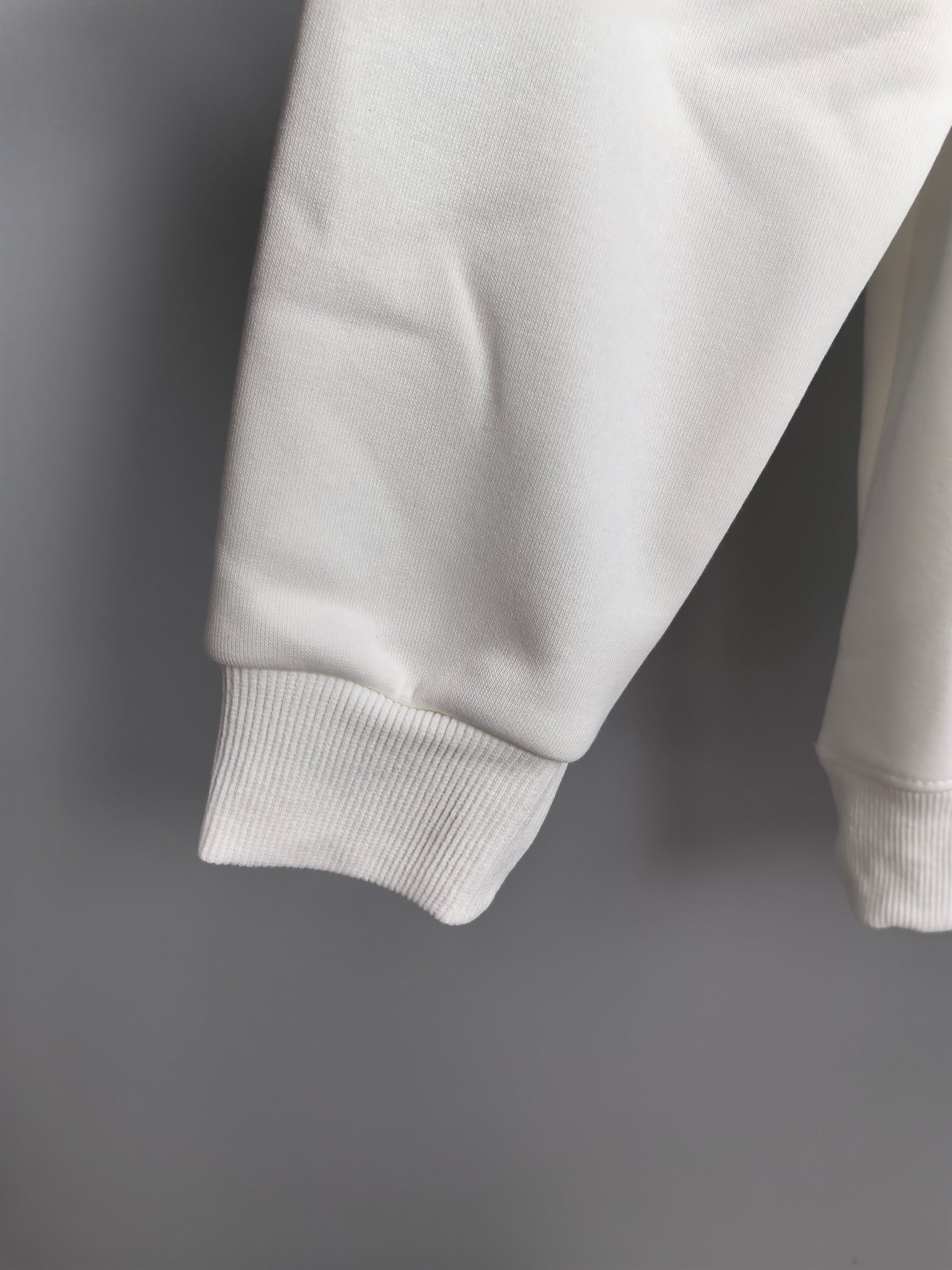 White hoodie cuffs and hem on long sleeves