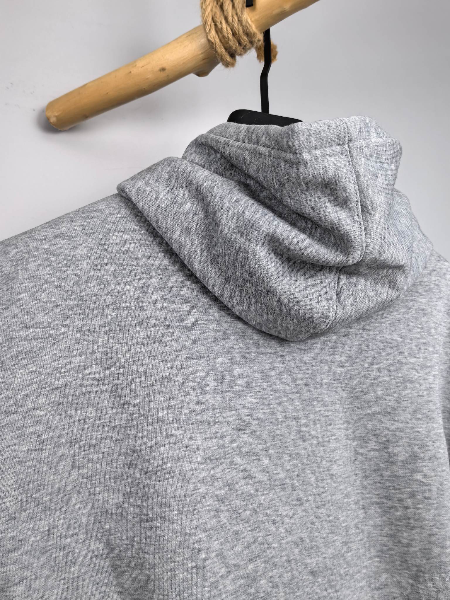 Gray pullover hoodie back view with hood and long sleeves