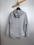 Gray long-sleeve hoodie with hood and small fish logo on the back