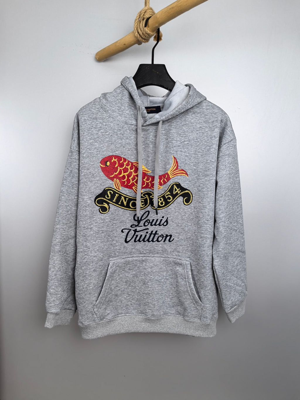 Gray long-sleeve hoodie with hood, front pocket, and colorful fish logo print